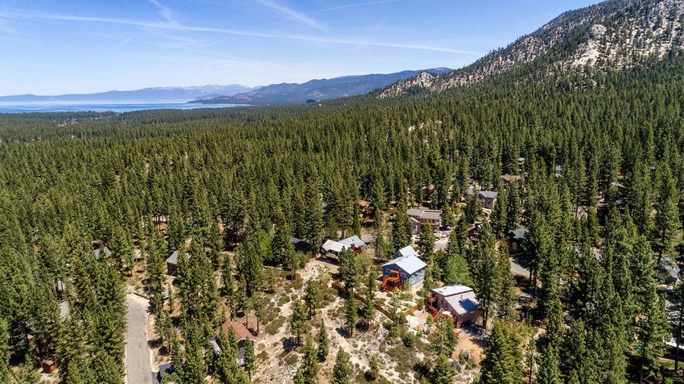 Towering pines and mountain peaks create a picture-perfect backdrop.