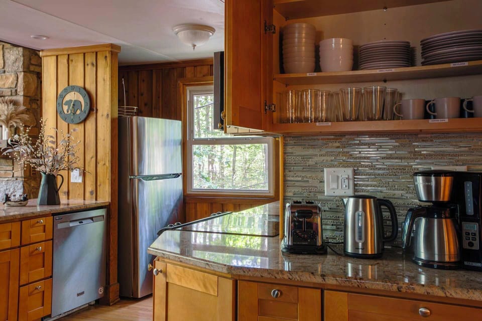 A kitchen that's fully stocked and includes a coffee area for your convenience.