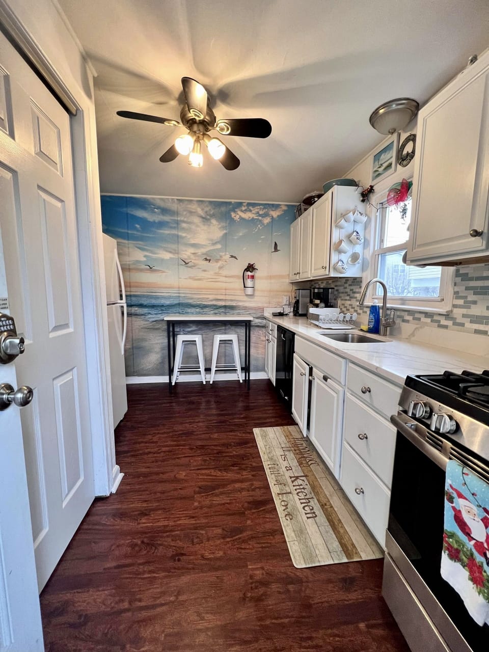 Galley kitchen has washing machine, dishwasher & complimemtary coffee station