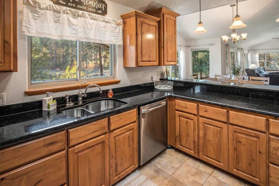 Large kitchen with a backyard view from the sink