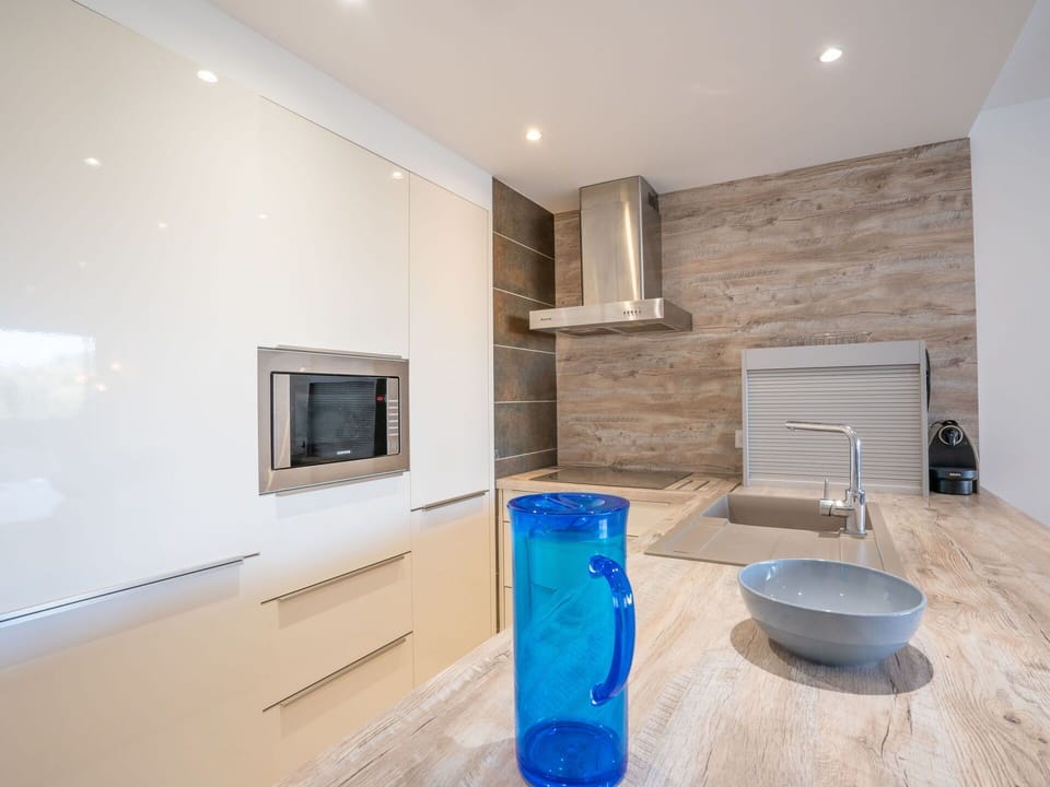 Property, Building, Wood, Plumbing Fixture, Tap, Cabinetry, Architecture, Interior Design, Floor, Flooring