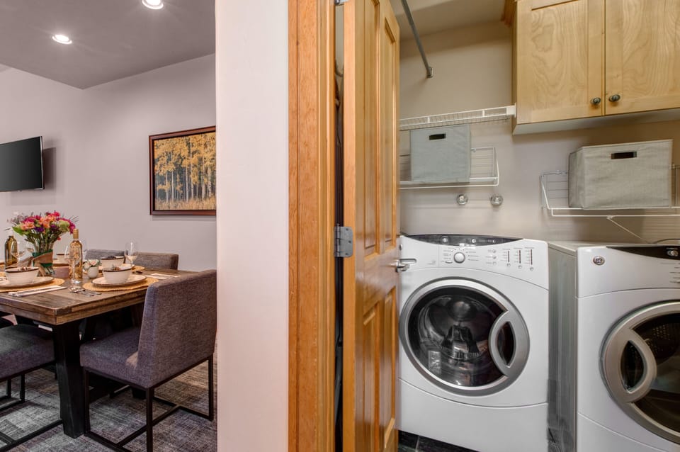 Main Level Laundry Room with full-sized washer and dryer