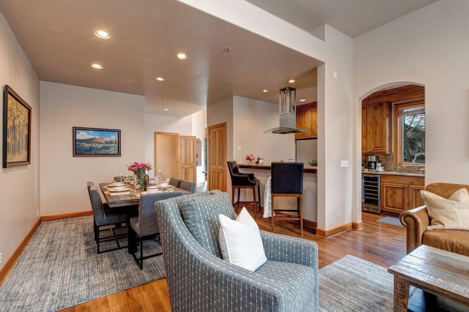 Living Room with plush leather furnishings, large, bright windows, brand new gas fireplace, and 55" Samsung smart tv
