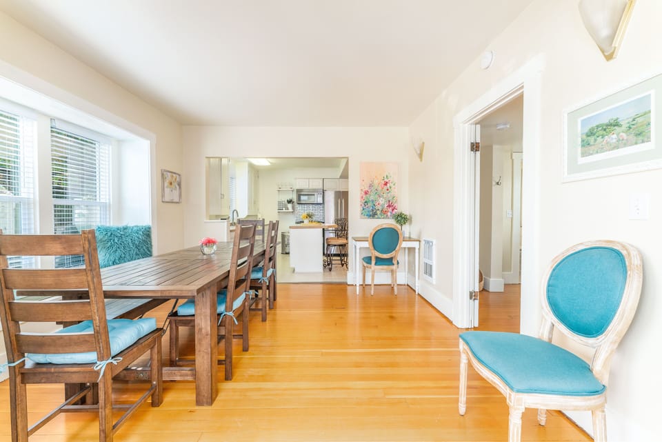 Dining room with window nook. View into Kitchen. Bedroom #4 off to the right. 