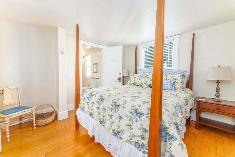 Main floor bedroom #4 with en suite bathroom. Queen bed.