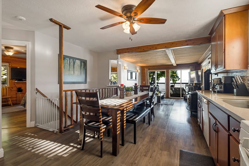 Stairs lead to the kitchen and upstairs bedrooms.