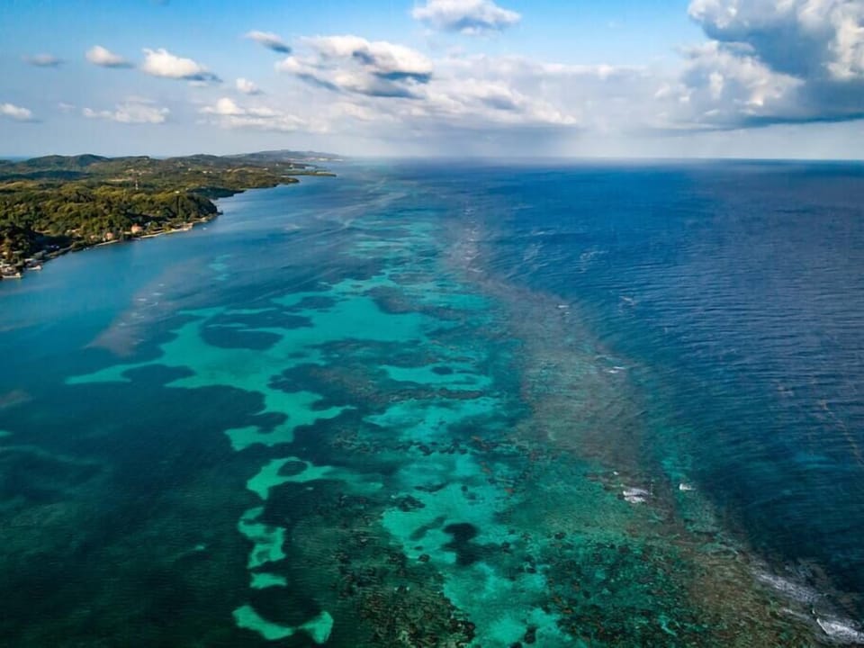 An aerial view of the second largest barrier reef in the world, the Mesoamerican Barrier Reef