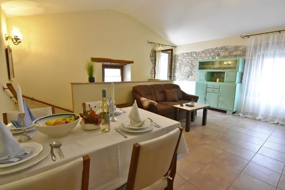 The living area with dining table and chairs