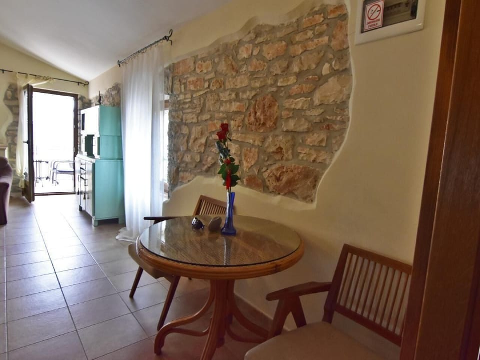The small table and chairs in the hallway leading to the bedroom.