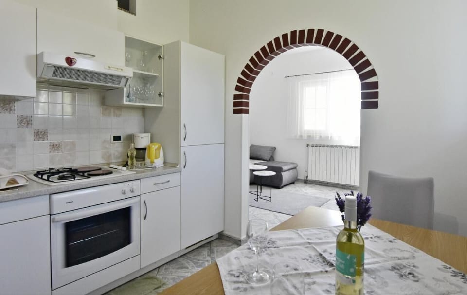 The kitchen equipped with a coffee machine, microwave oven, dishwasher.