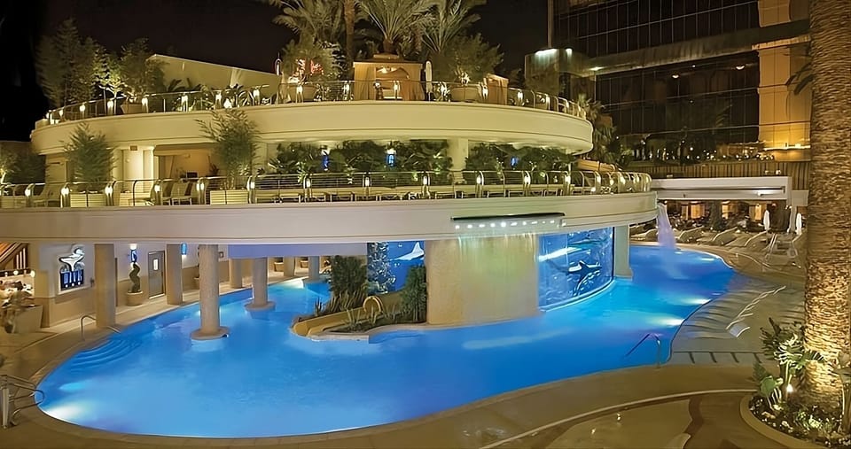 Lounge in style with pool views and sleek bar seating.