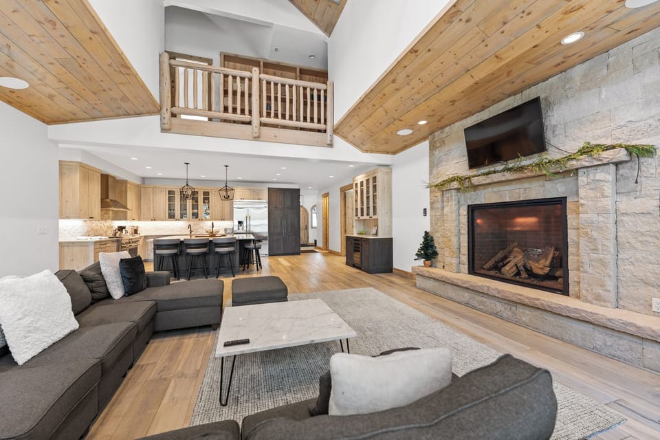 Open-concept space with a vaulted ceiling and ample lighting.