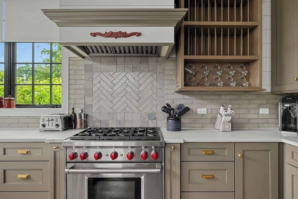 High-end appliances anchor this stunning chef’s kitchen.
