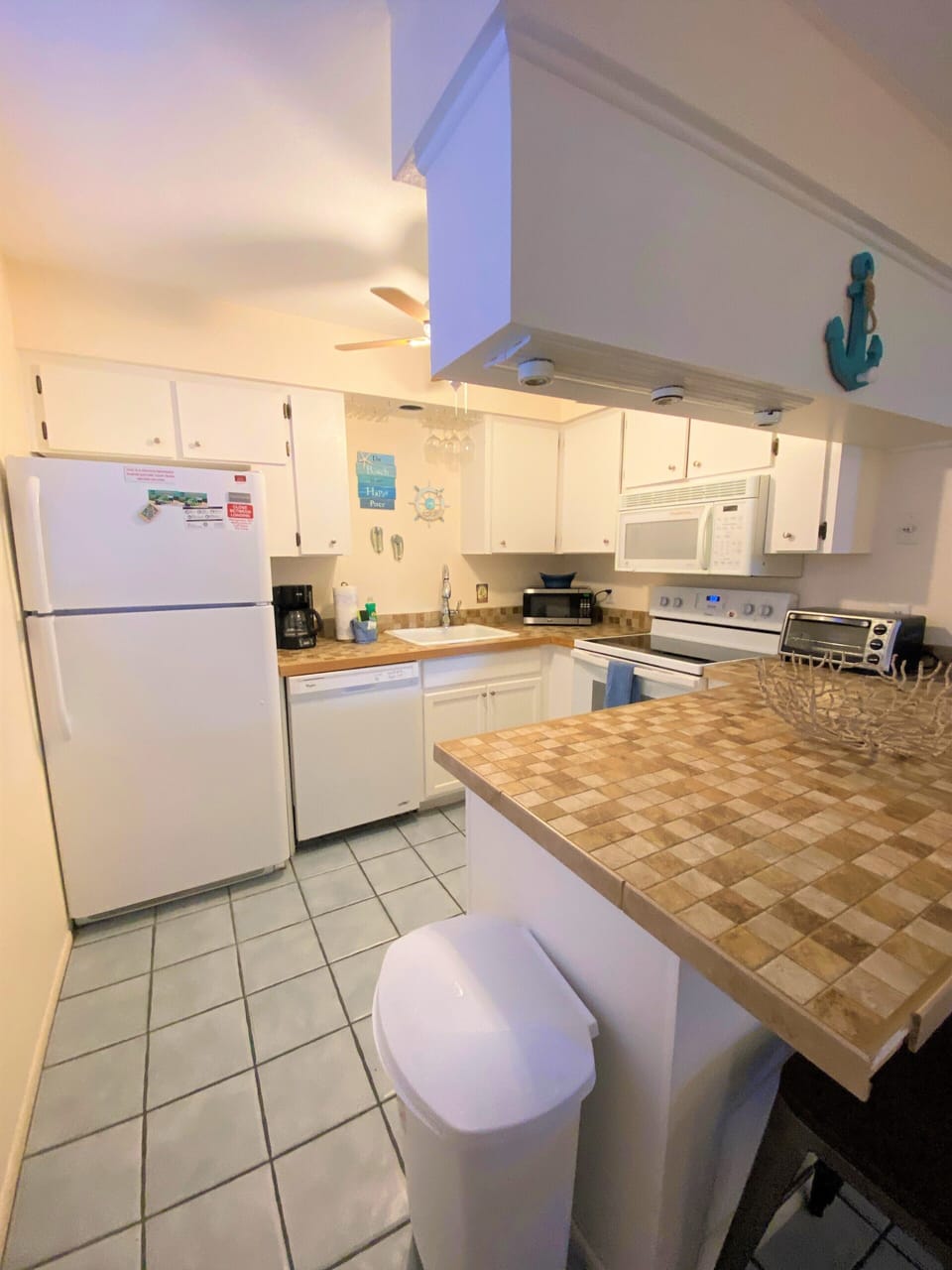 Full kitchen, dishwasher, stove, microwave, all linens , and dining utensils 6