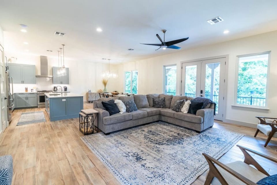 Magnolia River Haus - Large living room with oversized sectional couch