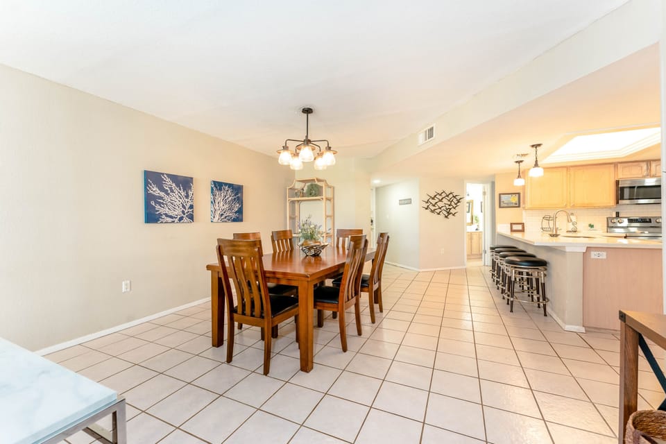 Pull up a seat and lay out the snacks! Our dining space is conveniently located beside the kitchen.