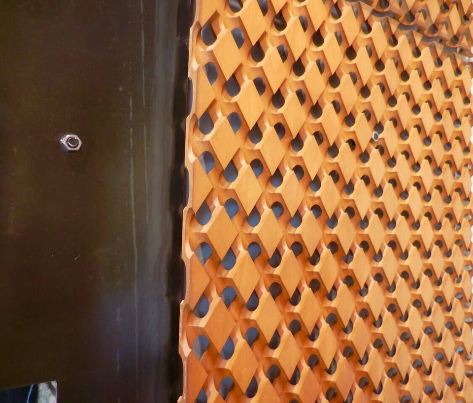 Original 1964 Sycamore wood screen beside the fireplace.