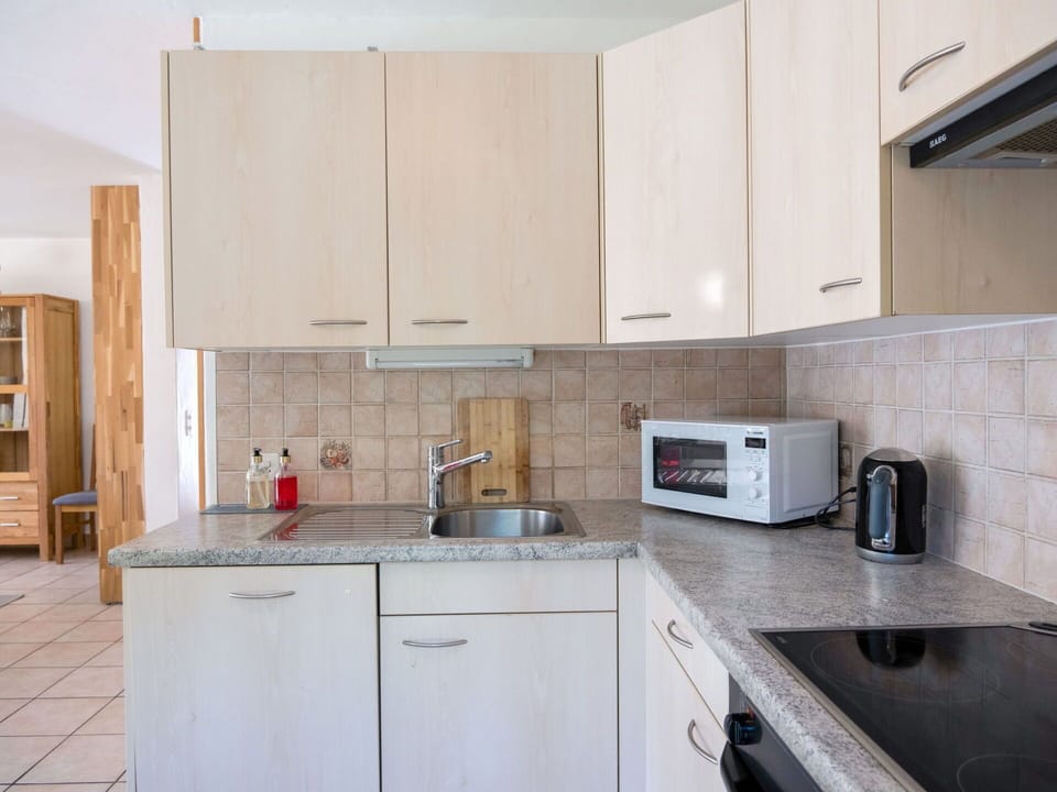 Cabinetry, Kitchen Sink, Countertop, Property, Furniture, Sink, Kitchen Appliance, Kitchen, Kitchen Stove, Building