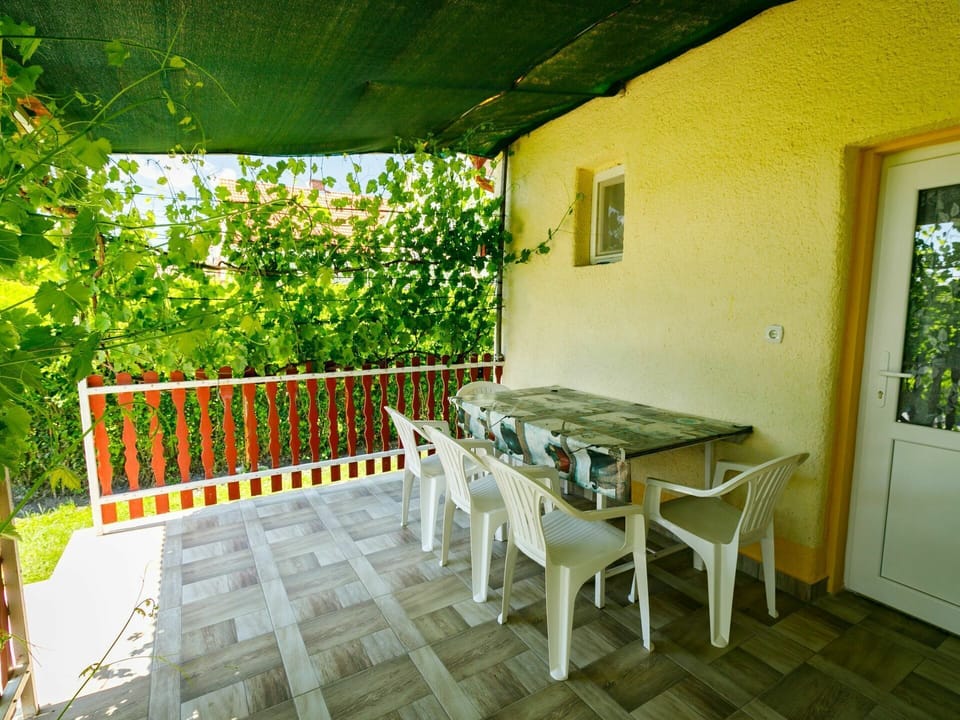 Building, Table, Furniture, Plant, Green, Window, Wood, Outdoor Furniture, Shade, Interior Design