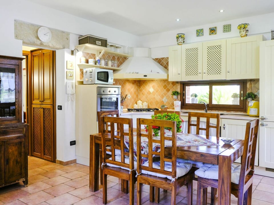 Furniture, Property, Picture Frame, Table, Cabinetry, Chair, Wood, Lighting, Interior Design, Flooring