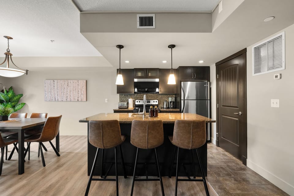 Granite island and stainless steel appliances make cooking a joy