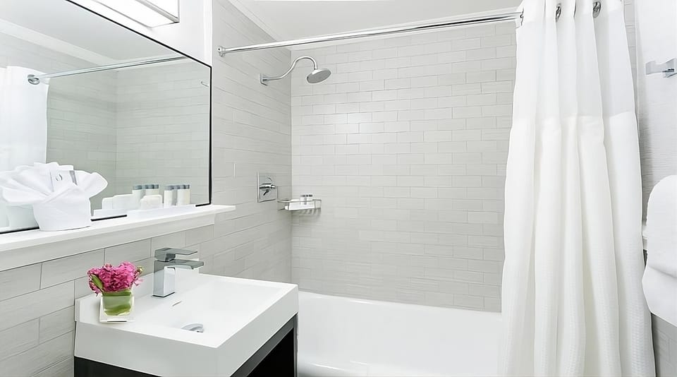 Refresh in a bright, modern bath with sleek fixtures.