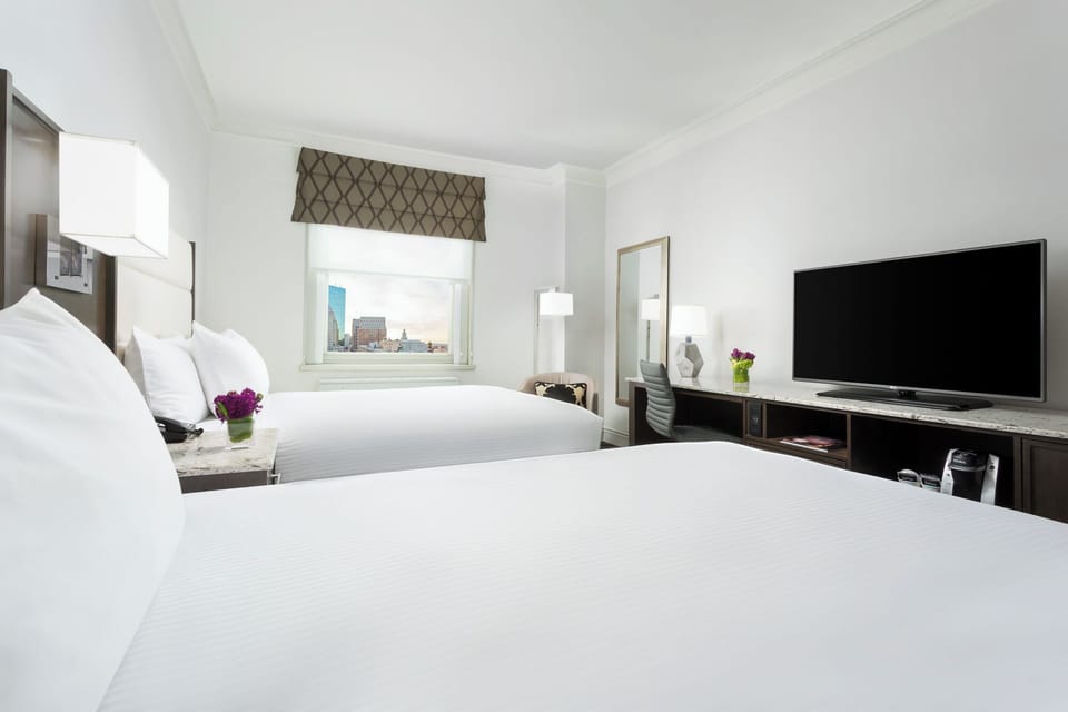 Kick back and stream favorites from bed with big-screen TV.