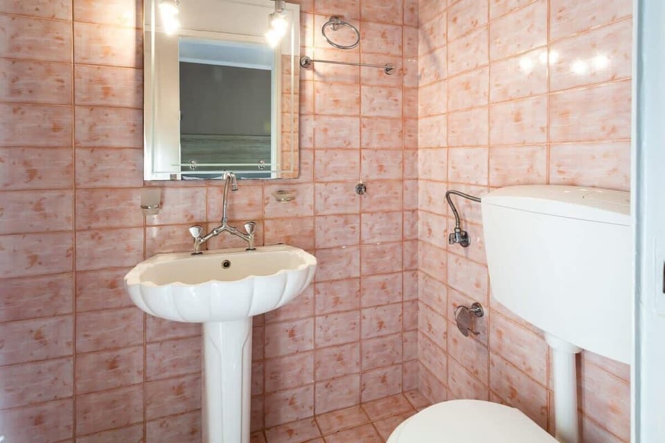 Refresh in a sleek and spotless bathroom.