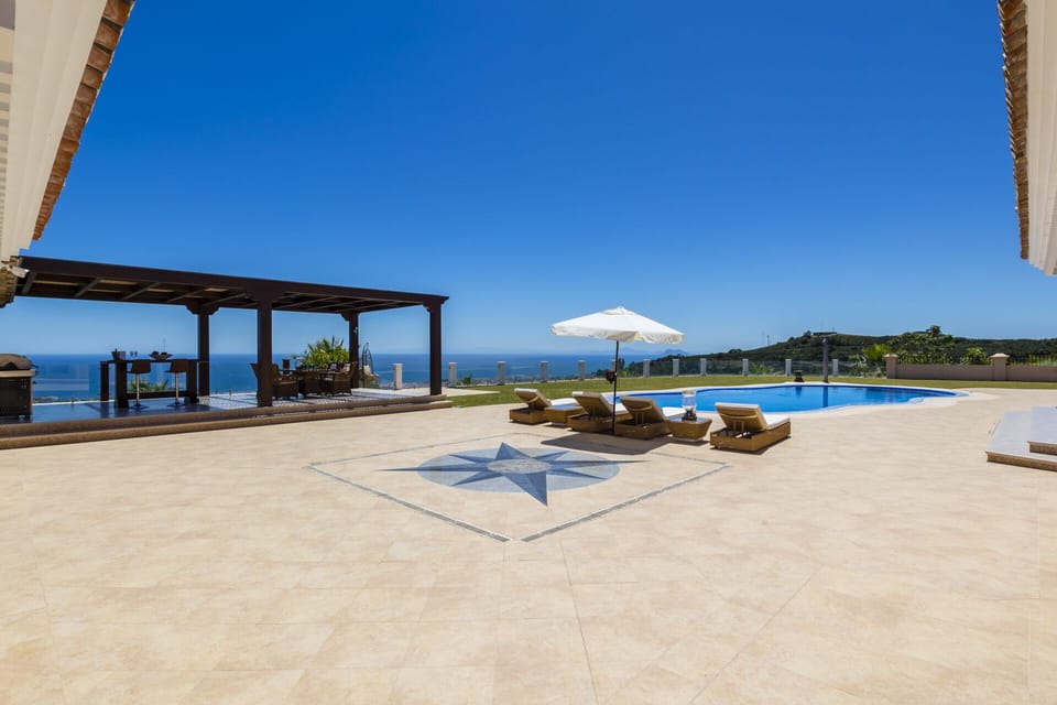 Pool area with sea views