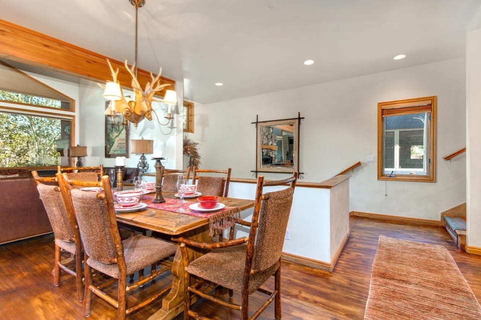 Alternate view of dining area with warm lighting and casual mountain charm.

