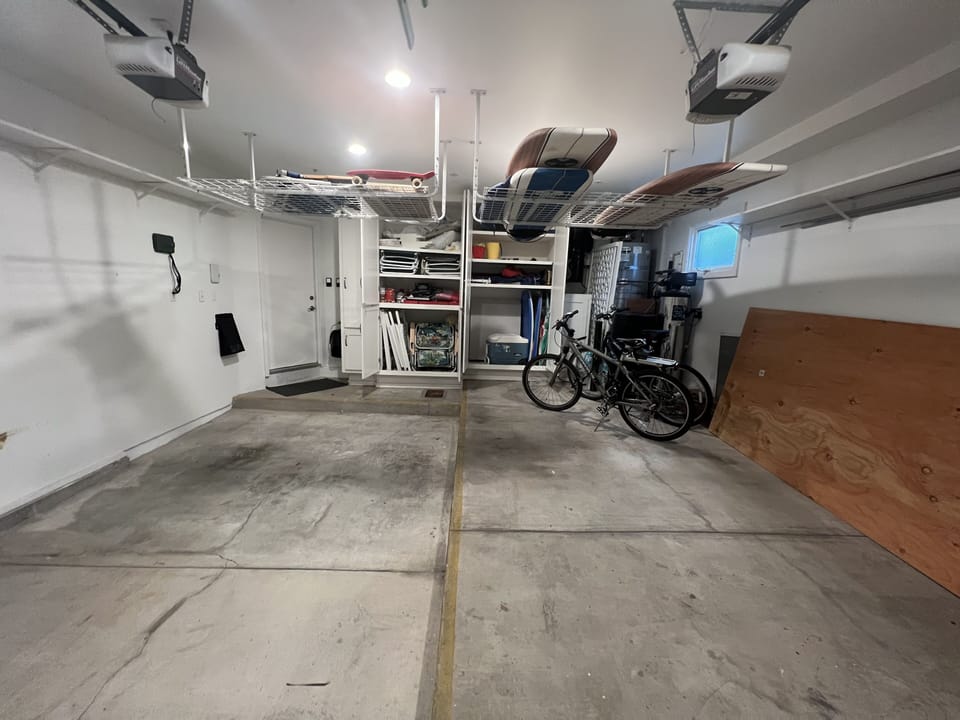 2 car garage. Bikes, surfboards, boogie boards, beach chairs, cooler, towels.