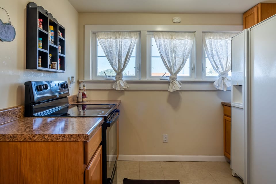 Kitchen features full size appliances and lots of light
