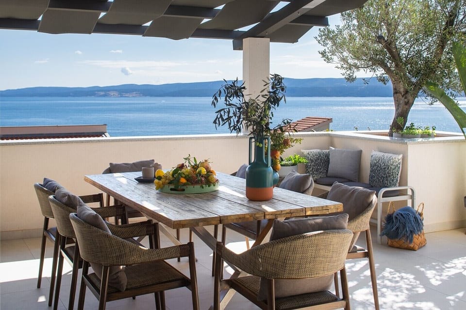 Covered outdoor dining area with an amazing sea view