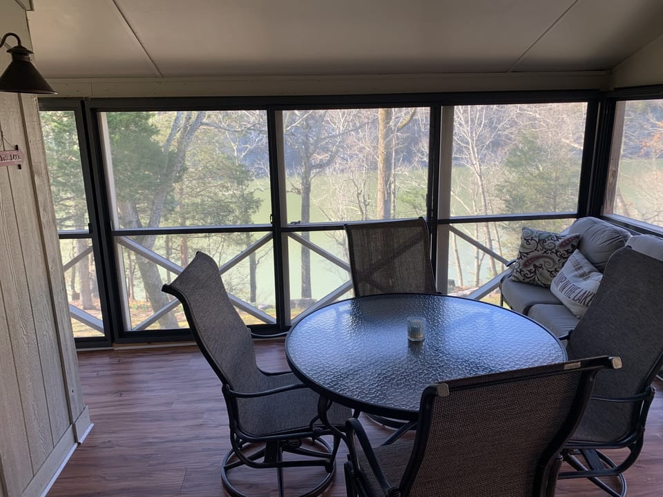 Covered screened in porch with vinyl sliders.  