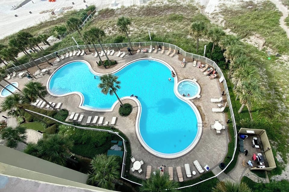 1 of 2 resort pools, beachside with gas grills for guest use