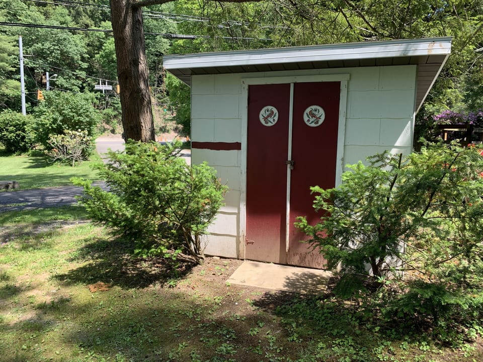 Gear Shed - Bikes, Golf Clubs, Fishing Rods, Yard Game storage.