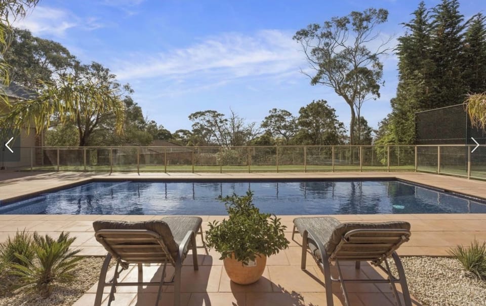 Solar-heated in-ground pool, fully tiled with large wide step in shallow end