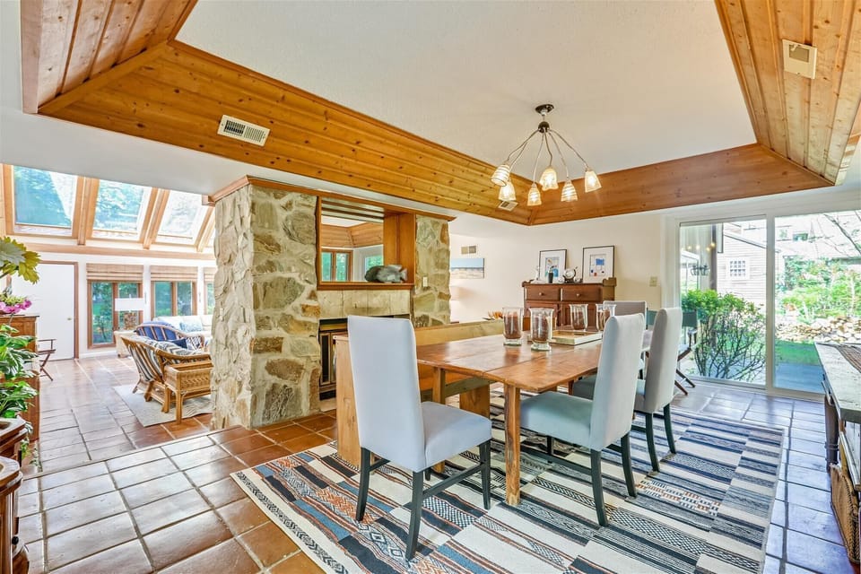 Dining Room Separated from Living Room with the Fire Place