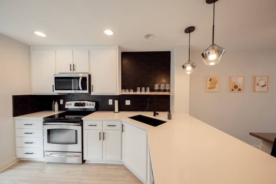 The modern kitchen comes fully equipped with everything you could need for your stay