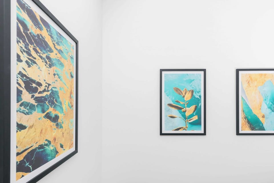 Stylish wall art adds a splash of color and personality to the clean, modern interior.