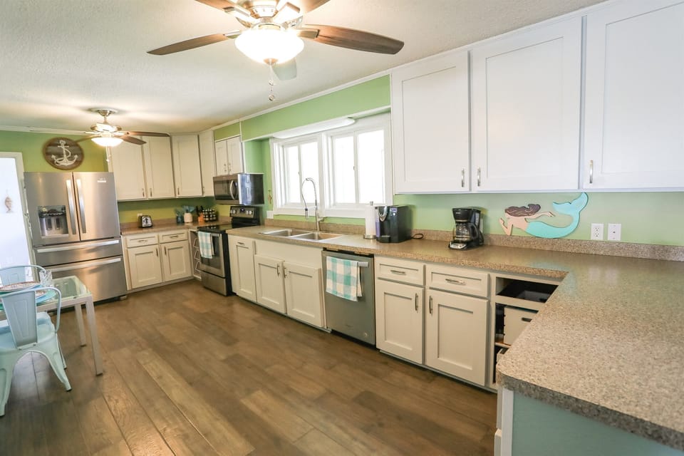 Large, well-stocked upstairs kitchen