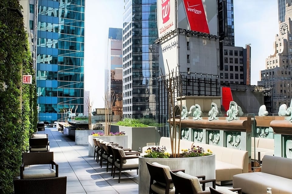 Unwind on the sunlit terrace with plush lounge seating.