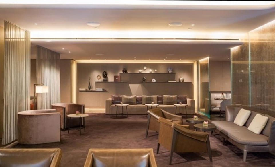 Unwind with cocktails in a plush, softly lit lounge.