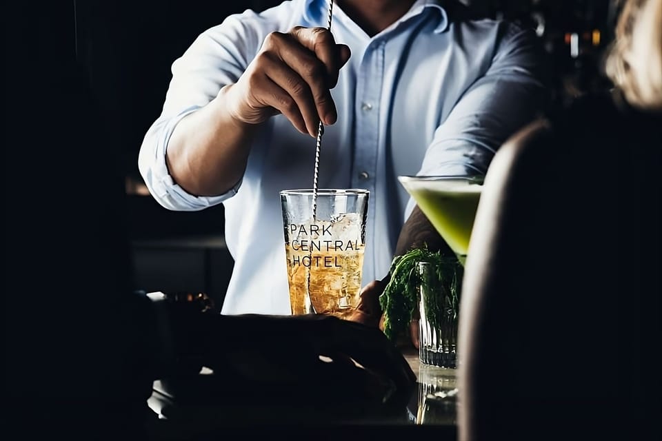 Toast the evening with signature cocktails in a cozy glow.