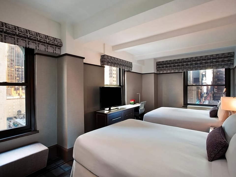Enjoy morning light and extra space around two comfortable beds.