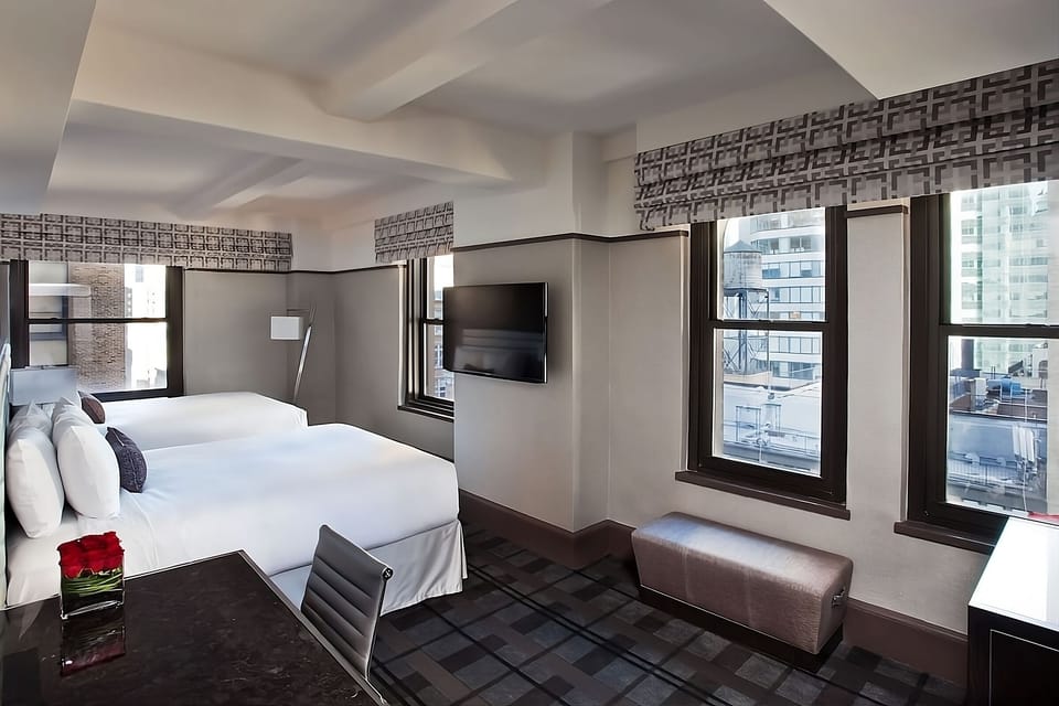 Stretch out and unwind beside wide windows and skyline scenery.