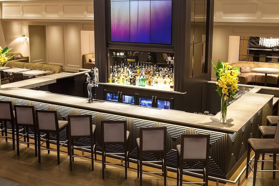 Sip craft cocktails at the polished bar after exploring.