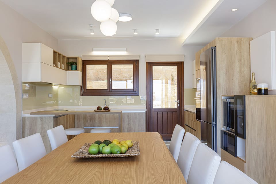 At the back of the kitchen leads to the barbecue area