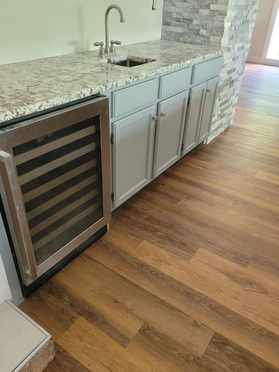 Main level mini bar and wine fridge