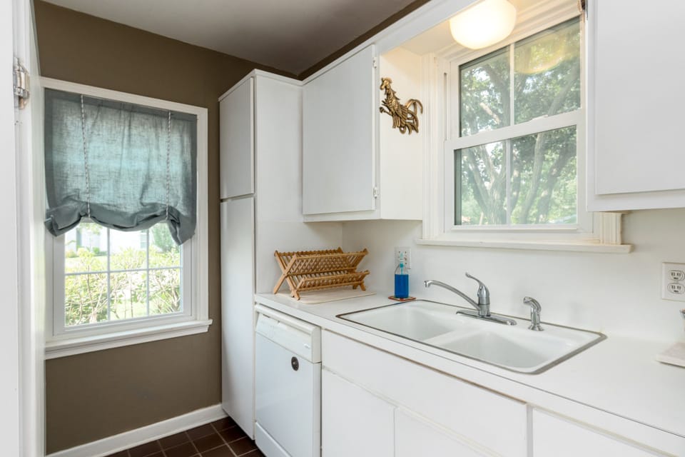 Laundry pantry with iron and board, etc